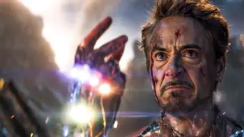 Tony Stark wearing the infinity gautlet about to make the ultimate sacrifice by snapping his fingers in Avengers Endgame